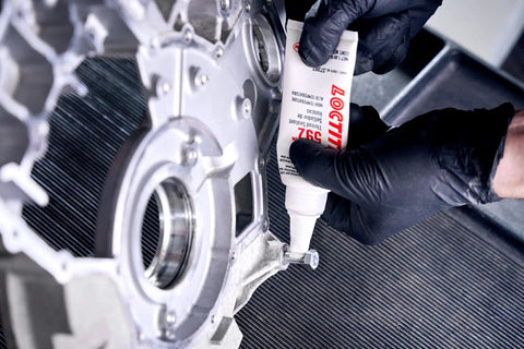 Opaque Automotive Thread Sealant With High Pressure Toughness And Thick Viscosity That Prevents Galling, 50 Ml being applied to engine