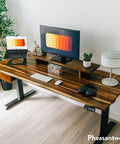 Solid Hardwood Standing Desk Featuring An Integrated Under Desk Drawer In Natural Walnut Finish 80 Inches Wide showing dual monitors and accessories.