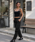 Model wearing Women's Cargo Hiking Pants With Elastic Waist, Water Resistant Quick Dry Parachute Style Baggy Fit, Black Size M