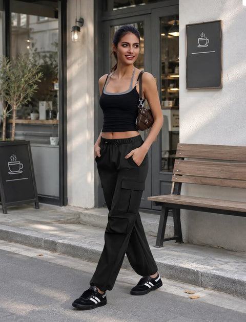 Model wearing Women's Cargo Hiking Pants With Elastic Waist, Water Resistant Quick Dry Parachute Style Baggy Fit, Black Size M