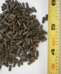 Pile of Roll Pins 23/32 X 1/4 Steel Pack Of 50 Heavy Duty Pins next to a measuring tape, ideal for DIY and industrial use.
