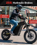 Rider on Villain 4160W Electric Dirt Bike With 52V 26Ah Battery showcasing dual hydraulic brakes on city street.