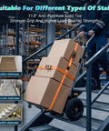 Heavy Duty Electric Stair Climbing Cart 1500W Motor With Anti-Slip Tires, Adjustable Speed powered hand truck carrying boxes down metal stairs.