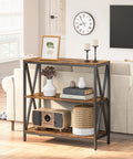 Game Changer Three Tier Industrial Console Table With Real Deal Storage Shelves Narrow Sofa Table For Entryway Foyer Living Room Decor Built Tough Rustic Brown Wood And Black Metal Frame in living room setting.