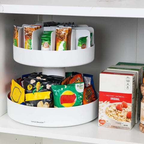 Smooth Rotating Two Tier Snack Carousel Countertop Organizer holding snacks in a tidy white resin design in a pantry.