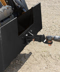 Beefed Up Heavy Duty Skid Steer Attachment Plate With Two Inch Receiver 3000 Lbs Capacity, attached to skid steer, in use.