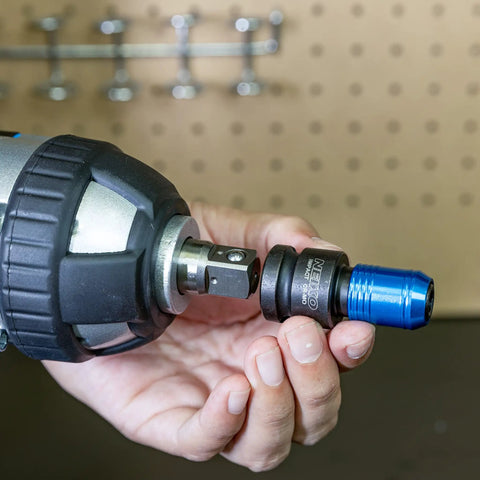 Impact Wrench Adapter One Half Inch Drive To One Quarter Inch Hex Converter With Quick Change Chuck shown in hand