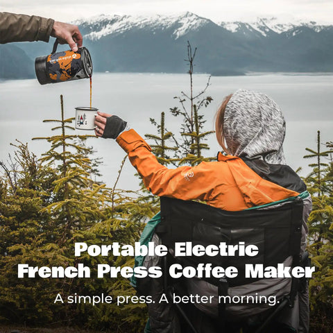 Person pouring coffee from Portable Camping Coffee Maker Electric French Press Travel Kettle 120V into a mug outdoors.