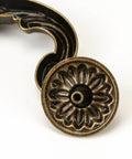 Close-up of antique yellow bronze handle end showing ornate design of Four Piece 150mm Center Drawer Pull Handles In Zinc Alloy Rustic Vintage Style Drop Down Bail Swing Dresser Cabinet Pulls With Antique Yellow Bronze Finish For Kitchen Cabinets And Furniture.