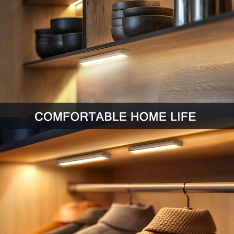 Motion Sensor Closet Night Light 10 LEDs Battery Operated Stick On 3 Pack illuminating closet shelves and clothing.