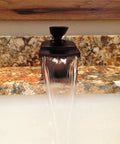 Waterfall Lav Faucet With Single Lever, Oil Rubbed Bronze Finish, water flowing over marble surface