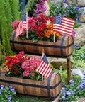 8x12 Inch American Flags On Sticks, 12 Pack With 17.5 Inch Wooden Poles, displayed in flower planters