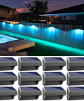 12 Pack Solar Fence Lights IP65 Waterproof Outdoor Lighting With Warm White And RGB Color Modes illuminating a backyard fence