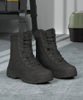 Mens Heavy Duty Steel Toe Work Boots For Construction And Industrial Safety With Puncture Resistant Midsole in a workshop setting.