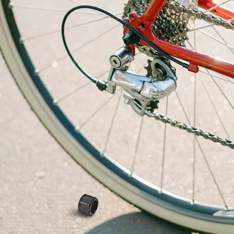 Rugged Aluminum Thru Axle Nut M15x1.5mm For Mountain Bikes And Electric Bikes Easy Install Durable Hub Nut next to bike wheel