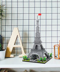 Epic Eiffel Tower Building Block Model Kit For Architecture Lovers A Realistic Paris Landmark Replica With Rich Details And Durable Pieces A Dope STEM Toy Great Gift For Builders And Collectors. Grey ABS Eiffel Tower building block model on desk display.