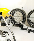 Real Deal Sectional Sewer Snake Machine 1.5 HP Drain Cleaner with 120 Foot Cable and Six Piece Cutter Set on display.