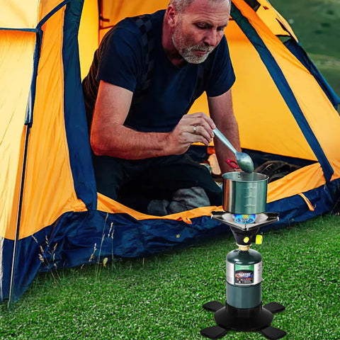 Man using Ultra Portable Propane Camping Stove With Quick Ignition outside tent for outdoor cooking.