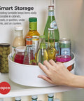 12 Inch Non Skid Lazy Susan Turntable Organizer With Easy Glide Spin And Sturdy Handles For Kitchen Pantry Cabinet Bathroom Laundry Garage in use with bottles.