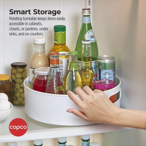 12 Inch Non Skid Lazy Susan Turntable Organizer With Easy Glide Spin And Sturdy Handles For Kitchen Pantry Cabinet Bathroom Laundry Garage in use with bottles.