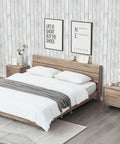 Bedroom with Peel And Stick White And Gray Wood Shiplap Wallpaper 17.7 By 118 Inches Self Adhesive Wall Covering behind bed.