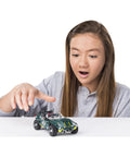 Child playing with Roadster 5-In-1 Building Kit With 174 Parts, Pull-Back Racer, Real Metal Components For STEM Engineering Education
