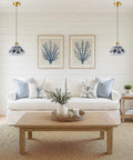 SIMEESO Ceramic Pendant Light,Chinese Blue and White Porcelain Pendant Lamp above a white sofa in a cozy living room setting.