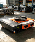 Heavy Duty Electric Transfer Cart With Trackless Design And Slick Wireless Remote Control For No Sweat Moving During Industrial Material Handling On A Rock Solid 360 Degree Rotating Turntable For Factory Warehouses, showing the cart's sleek design in an industrial setting.