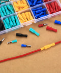 200 Pcs Bullet Connectors Set Male And Female 22 16AWG Insulated Splice Terminals assorted colors on wood surface