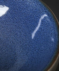 Close-up of Hella Sleek Round Porcelain Bathroom Vessel Sink With Chrome Pop Up Drain, glossy blue finish.