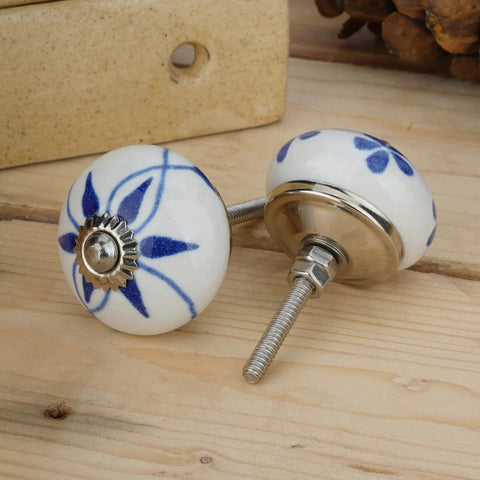 Top Shelf 10 Pack Ceramic Cabinet Knobs With Blue And White Printed Antique Patterns Sweet Glossy Finish Drawer Pull Handles For Kitchen Cupboards And Wardrobes. Close-up of two ceramic knobs with blue patterns.
