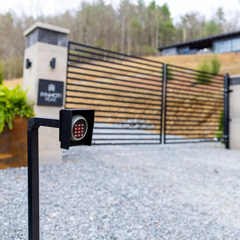 Beefy Universal Gate Keypad Mounting Post for Swing and Sliding Openers Weatherproof Iron Post in front of modern gate