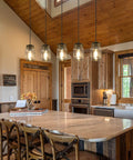 Five Light Mason Jar Pendant Lighting Fixture Black Rustic Farmhouse Chandelier in kitchen with wood accents and marble island