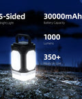 Rechargeable Camping Lantern With Five Sided Lighting, 1000 Lumens, 350 Hour Runtime, 30000mAh Power Bank displayed outdoors at night