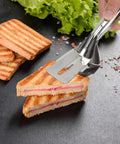 Using Multifunction 11 Inch Premium Stainless Steel Tongs 3 In 1 Gripper Flip And Scraper For Grilling to serve a sandwich