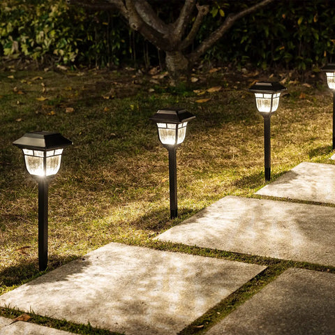 Solar Pathway Lights 4 Pack Outdoor Garden LED Lights IP65 Waterproof Glass and Metal along walkway at night