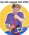 Child assembling Hands On Rubber Band Propeller Car Kit 10 Pack For STEM Projects Kids 8 And Up Learn Energy To Motion in classroom.