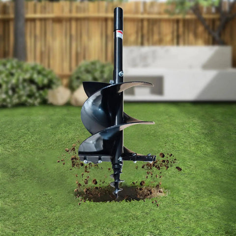 Beefy 18 Inch Earth Auger Drill Bit Set For Tractor Mounts in action, 2 Inch Round Drive, digging into the grass-filled ground
