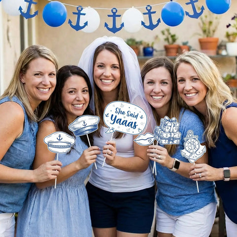 Women holding Last Sail Before The Veil Photo Booth Props Kit 24 Nautical Bachelorette Party Decorations with smiles and props