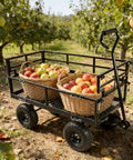 Heavy Duty Steel Dump Cart With 600 Lb Capacity Utility Wagon And Inflatable Ten Inch Tires hauling apples in orchard
