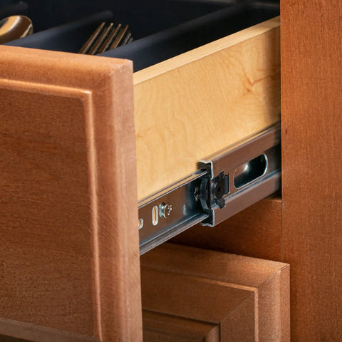 Side view of a 20 Inch Double Spring Soft Close Drawer Slide installed in a wooden kitchen cabinet, showing ball bearing detail.