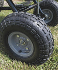 Tow Behind Broadcast Spreader With 85 Lb Capacity For Lawns, 10 Foot Spread, Covers Up To 14,000 Sq Ft, wheels on grass