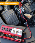 Heavy Duty 1000W Car Power Inverter That Converts 12V DC To 110V AC Smoothly with battery clip connection in a vehicle's engine bay.