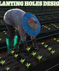 Person uses Garden Weed Barrier Fabric With Pre-Punched 132 Planting Holes For Quick No-Fuss Planting in vegetable garden.