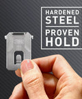 Hand holding 3M hardened steel hanger from Claw Drywall Picture Hanger Variety Pack With Spot Markers For Heavy Mirrors And Frames