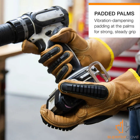 Hands wearing Endura Impact Leather Work Gloves With Water Resistance And Padded Palms holding an electric drill