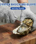 Person wearing gray Level 5 Cut Resistant Gloves For Chefs And Butchers With Food Grade Puncture Resistant Safety Tough As Nails Grip Size Large, shucking oysters on wooden board.
