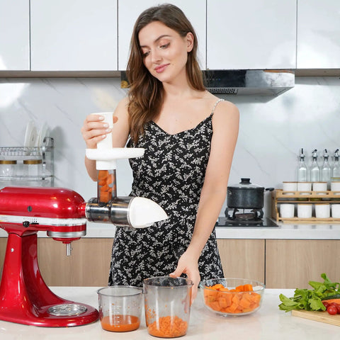 Woman using stand mixer with masticating juicer attachment, extracting juice from veggies, Turn Your Stand Mixer Into A Legit Slow Juicer With This Masticating Attachment, Extract Nutritious Juice From Fruits And Veggies, Separate Pomace Easily, Easy To Use, White Finish, Fits All Models.