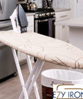 Heavy Duty Padded Ironing Board Cover And Pad No Fuss 15x54 Inches with Elastic Edge on iron board in kitchen scene.