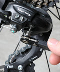 Using Top Shelf Mini Ratchet Set, 34 Piece Cr-V Steel Kit, to adjust bicycle derailleur in tight space.